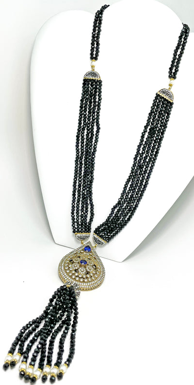 Handmade necklace made of black crystals with large pendant with navy blue color natural gemstone